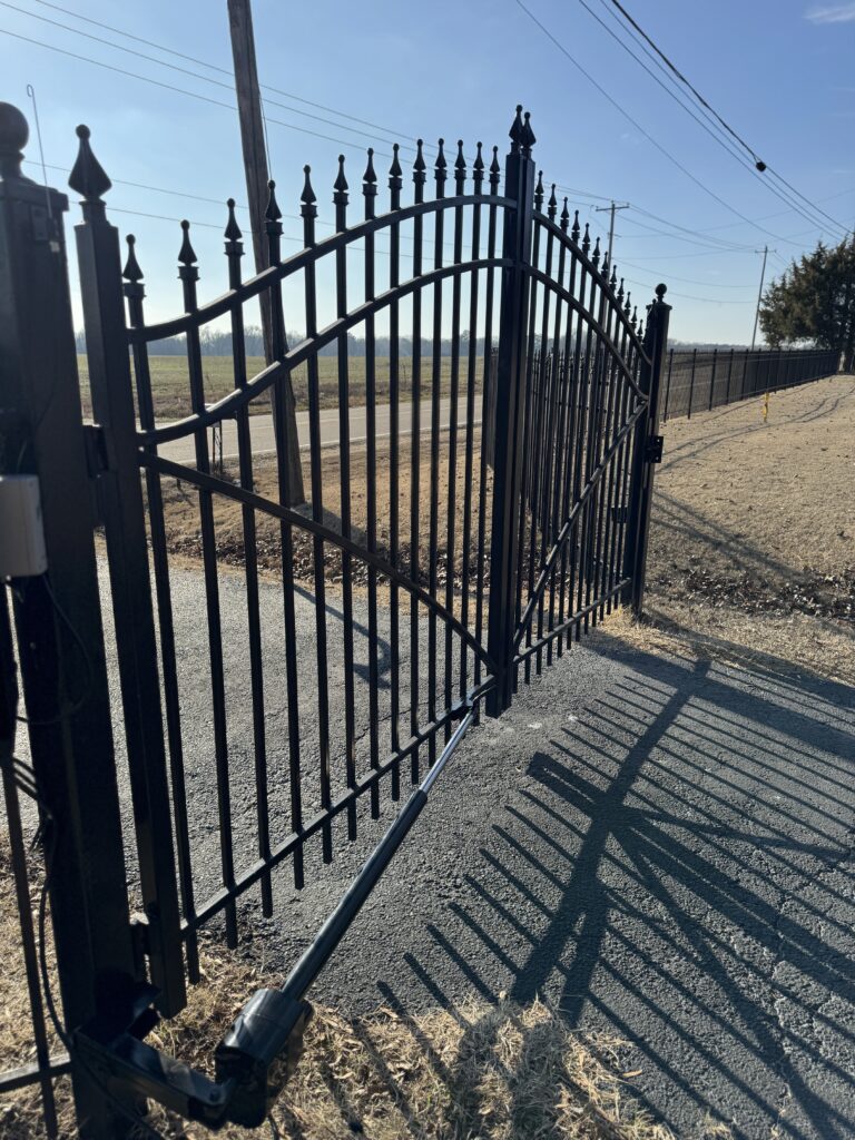 Automated swing gate system installed by Inlay Automation at a residential home in Memphis, TN